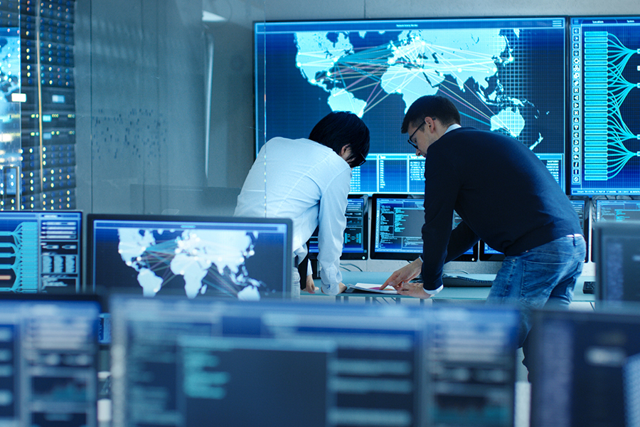 Cybersecurity expert monitoring network security in a control center, ensuring fast and thorough penetration testing in Japan